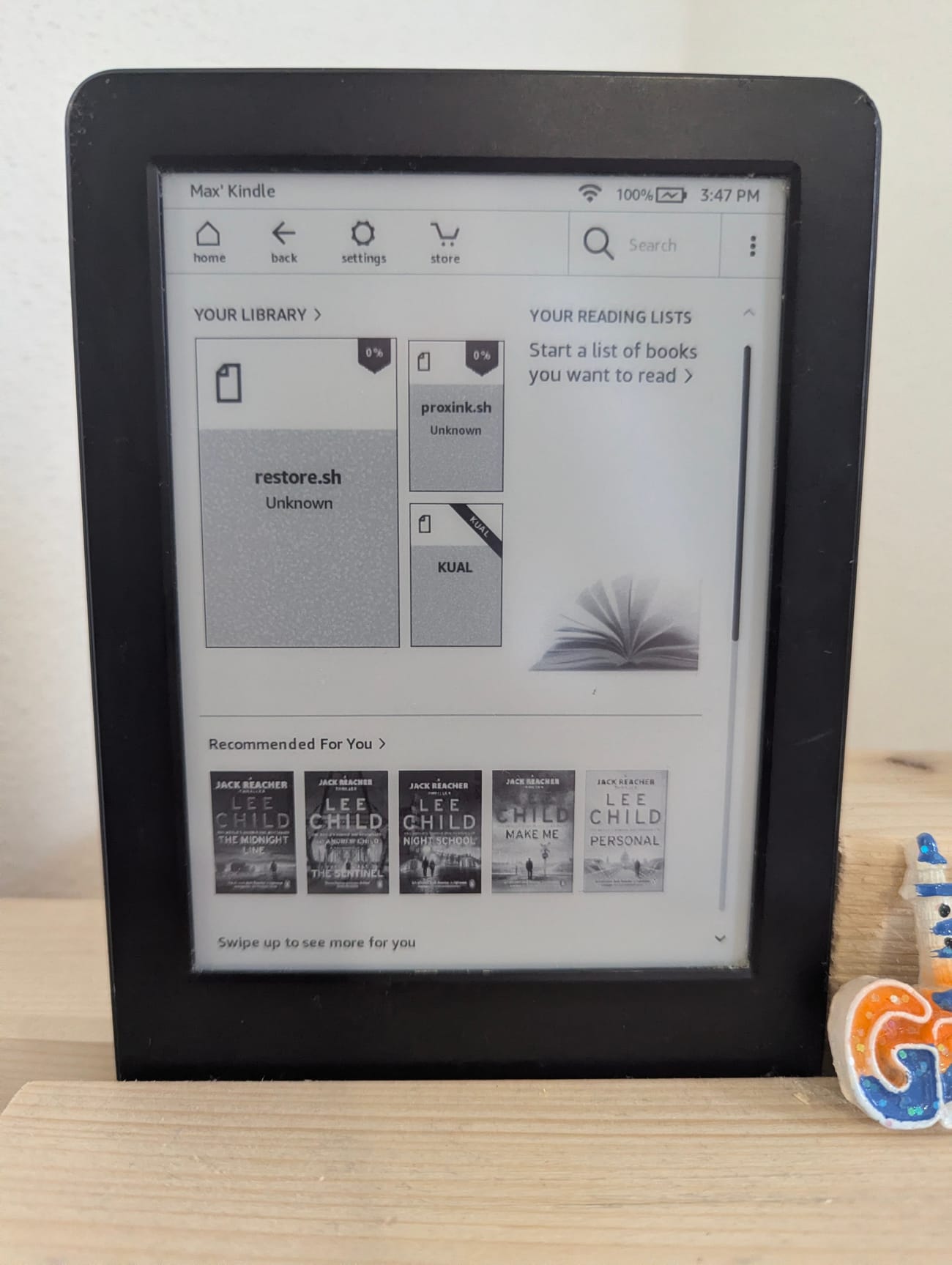 The dashboard scripts sitting in the Kindle library next to KUAL